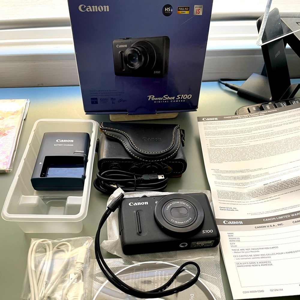 Gently used Canon PowerShot s100 digital camera